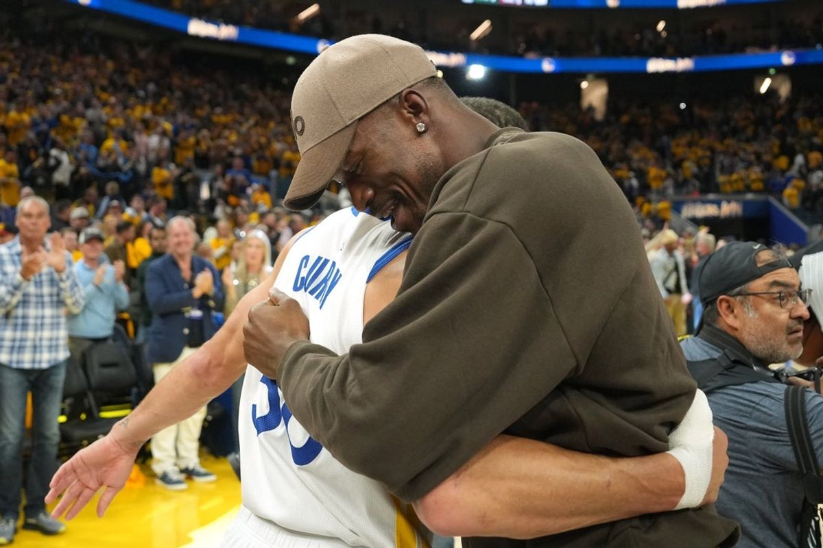 Apr 26, 2025; San Francisco, California, USA; Golden State Warriors guard Stephen Curry (left) and forward Jimmy Butler III (right) hug after defeating the Houston Rockets during game three of first round for the 2024 NBA Playoffs at Chase Center. Mandatory Credit: Darren Yamashita-Imagn Images