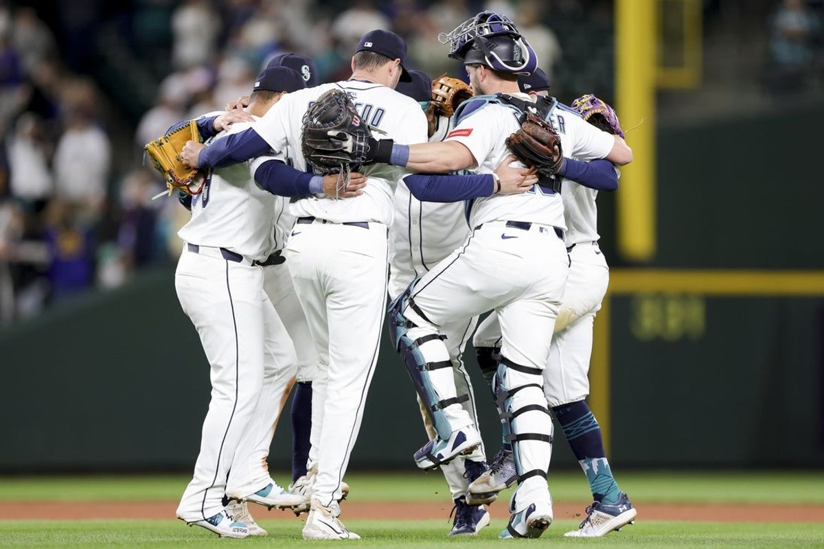 Apr 26, 2025; Seattle, Washington, USA; Seattle Mariners celebrate after the team’s win in an MLB game against the Miami Marlins at T-Mobile Park. Mandatory Credit: Ryan Sun-Imagn Images