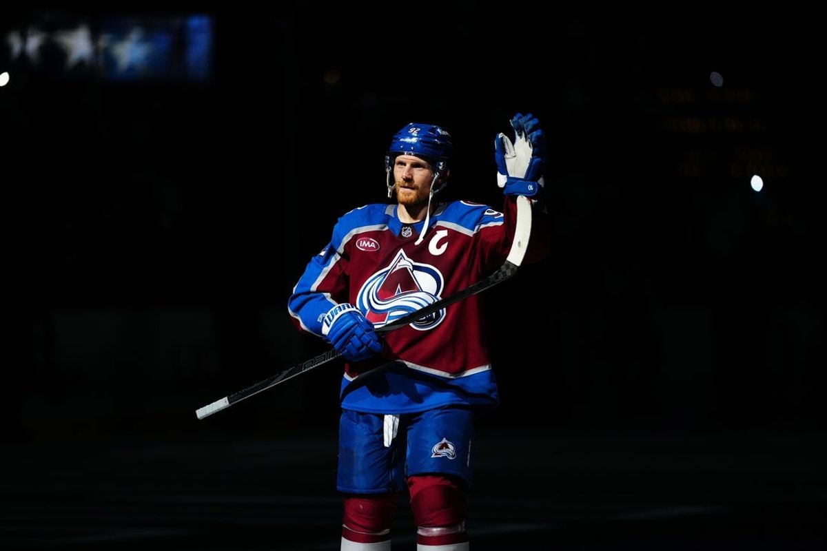 Mar 25, 2025; Denver, Colorado, USA;  First star of the game Colorado Avalanche left wing Gabriel Landeskog (92) following win over the Dallas Stars at Ball Arena. Mandatory Credit: Ron Chenoy-Imagn Images
