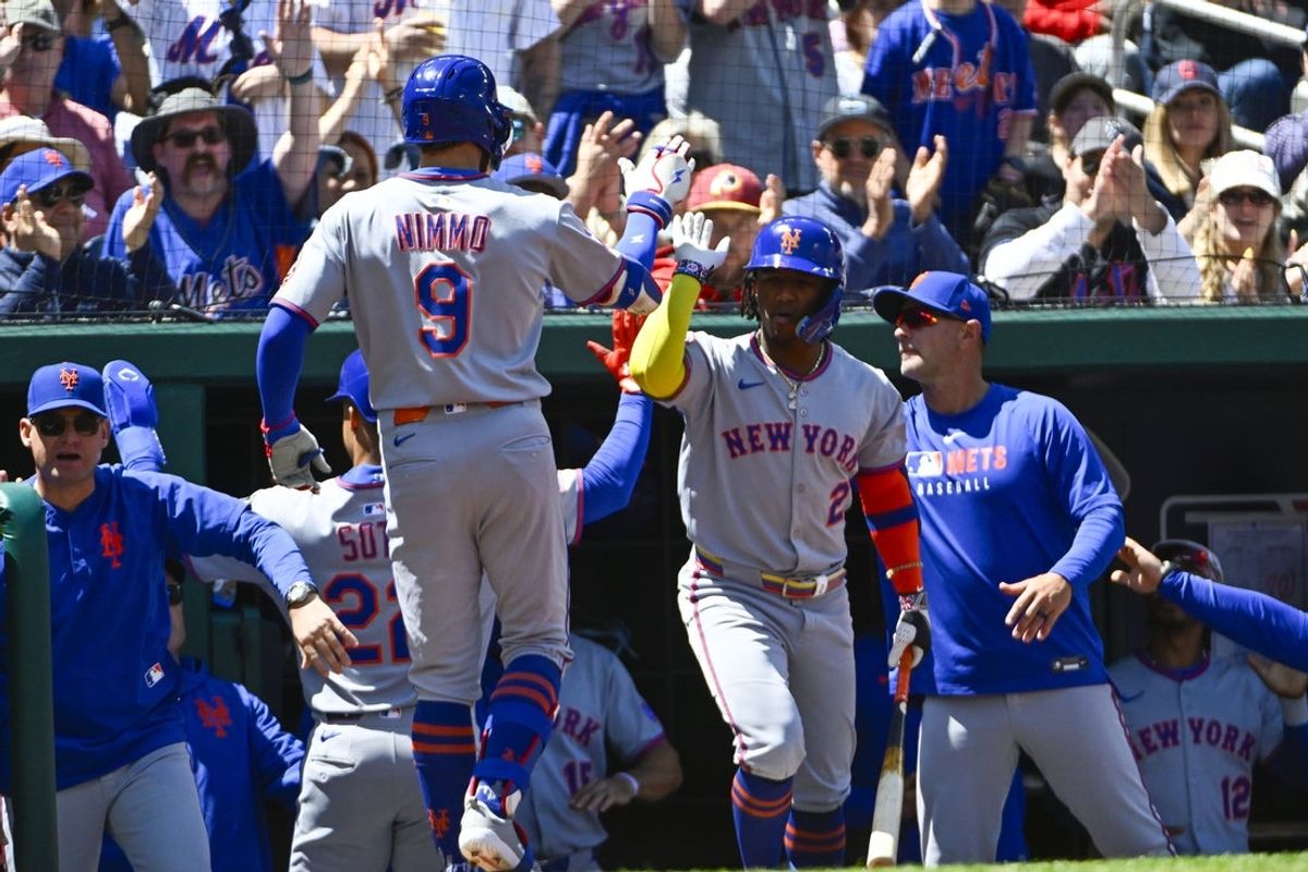 Apr 27, 2025; Washington, District of Columbia, USA; New York Mets left fielder Brandon Nimmo (9) is congratulated by second baseman Luisangel Acuna (2) after hitting a RBI sacrifice fly against the Washington Nationals during the first inning at Nationals Park. Mandatory Credit: Brad Mills-Imagn Images
