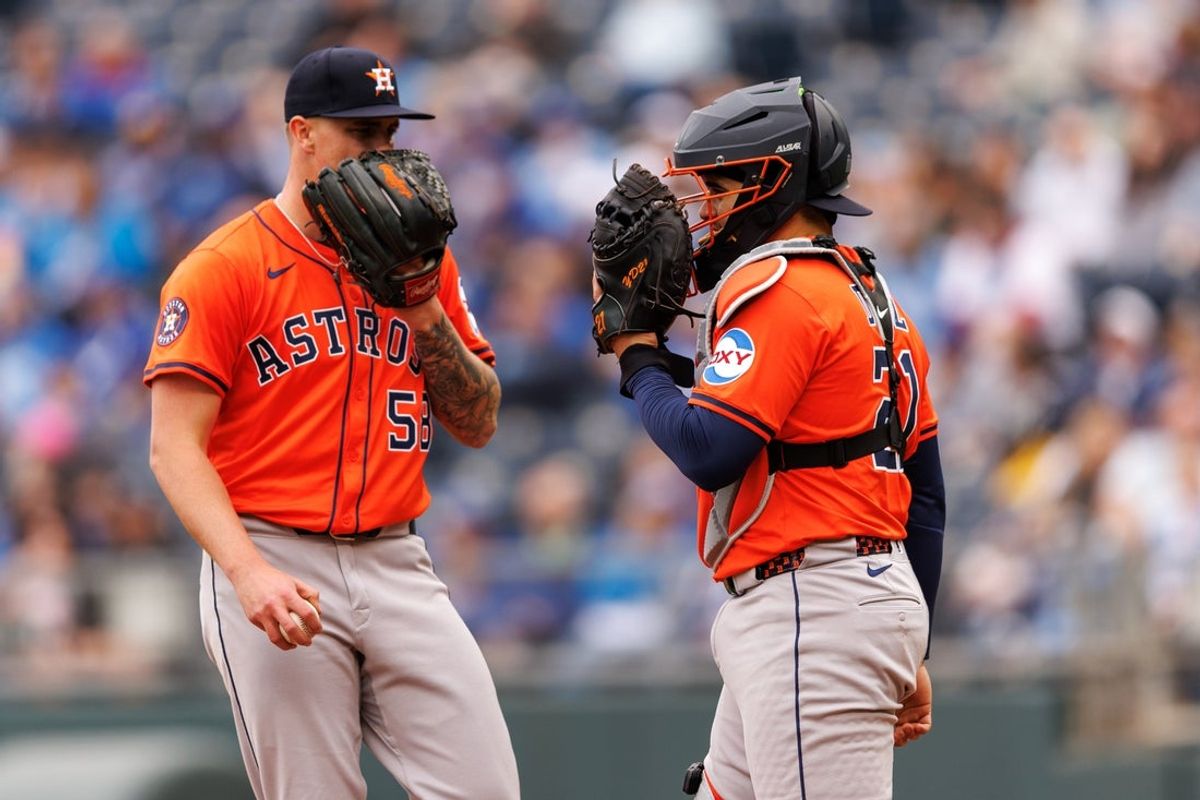 Apr 27, 2025; Kansas City, Missouri, USA; Houston Astros catcher Yainer Diaz (21) and Houston Astros pitcher Hunter Brown (58) talk on the mound during the second inning against the Kansas City Royals at Kauffman Stadium. Mandatory Credit: William Purnell-Imagn Images
