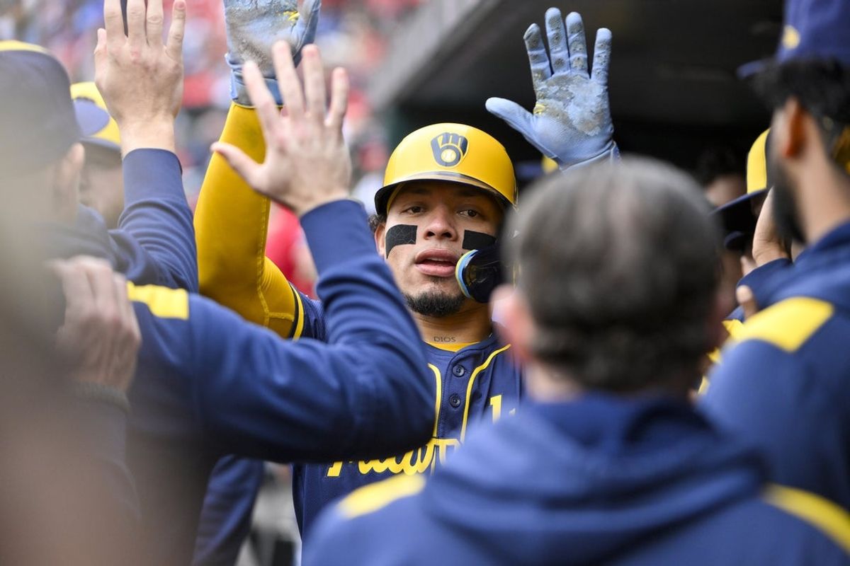 Apr 27, 2025; St. Louis, Missouri, USA;  Milwaukee Brewers catcher William Contreras (24) is congratulated by teammates after scoring against the St. Louis Cardinals during the first inning at Busch Stadium. Mandatory Credit: Jeff Curry-Imagn Images