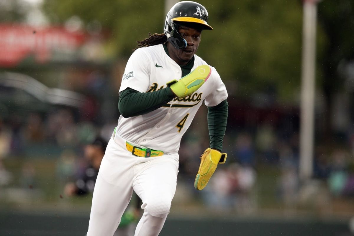 Apr 27, 2025; West Sacramento, California, USA; Athletics right fielder Lawrence Butler (4) heads for third base and looks to score on a double by Brent Rooker against the Chicago White Sox during the first inning at Sutter Health Park. Mandatory Credit: D. Ross Cameron-Imagn Images