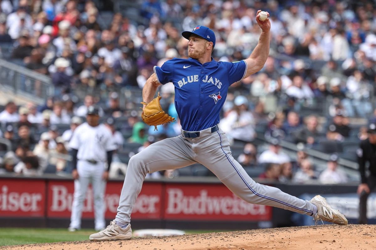Apr 27, 2025; Bronx, New York, USA; Toronto Blue Jays relief pitcher Josh Walker (21) delivers a pitch during the seventh inning against the New York Yankees at Yankee Stadium. Mandatory Credit: Vincent Carchietta-Imagn Images