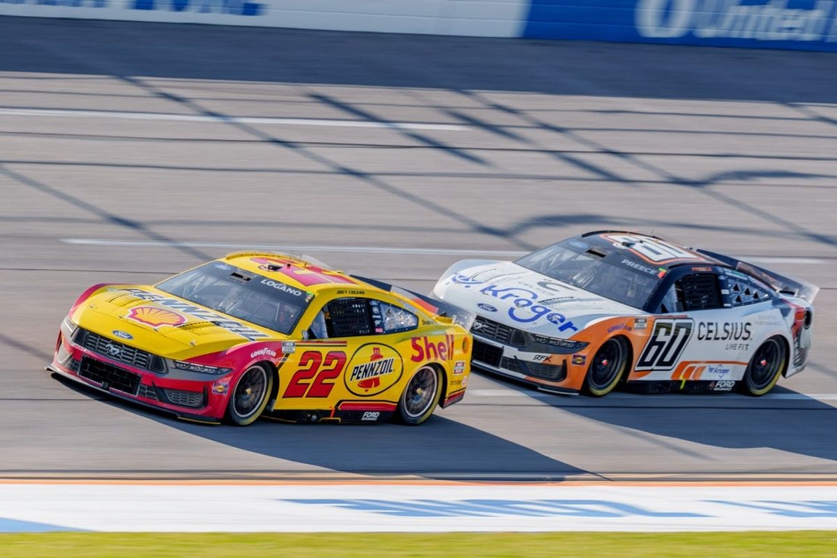 Apr 26, 2025; Talladega, Alabama, USA; NASCAR Cup Series driver Joey Logano (22) and NASCAR Cup Series driver Ryan Preece (60) go into turn one at Talladega Superspeedway. Mandatory Credit: Jason Allen-Imagn Images