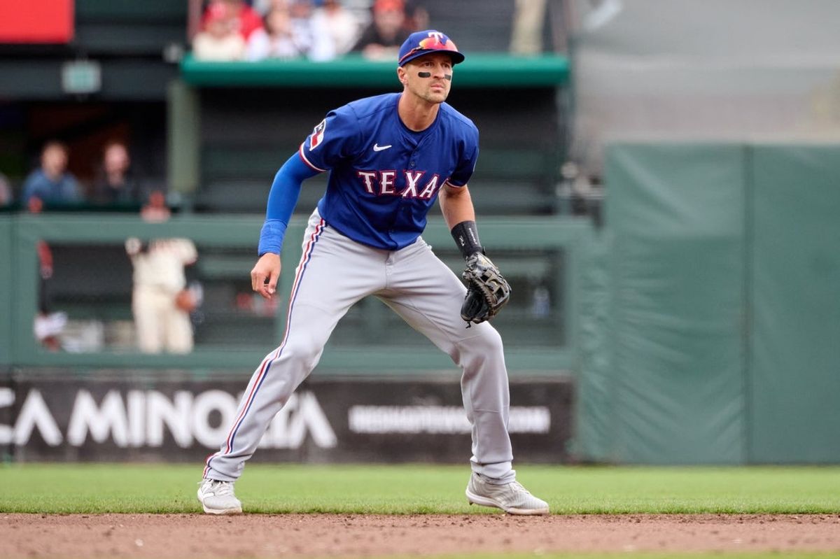 Apr 27, 2025; San Francisco, California, USA; Texas Rangers shortstop Nick Ahmed (23) during the fifth inning against the San Francisco Giants at Oracle Park. Mandatory Credit: Robert Edwards-Imagn Images