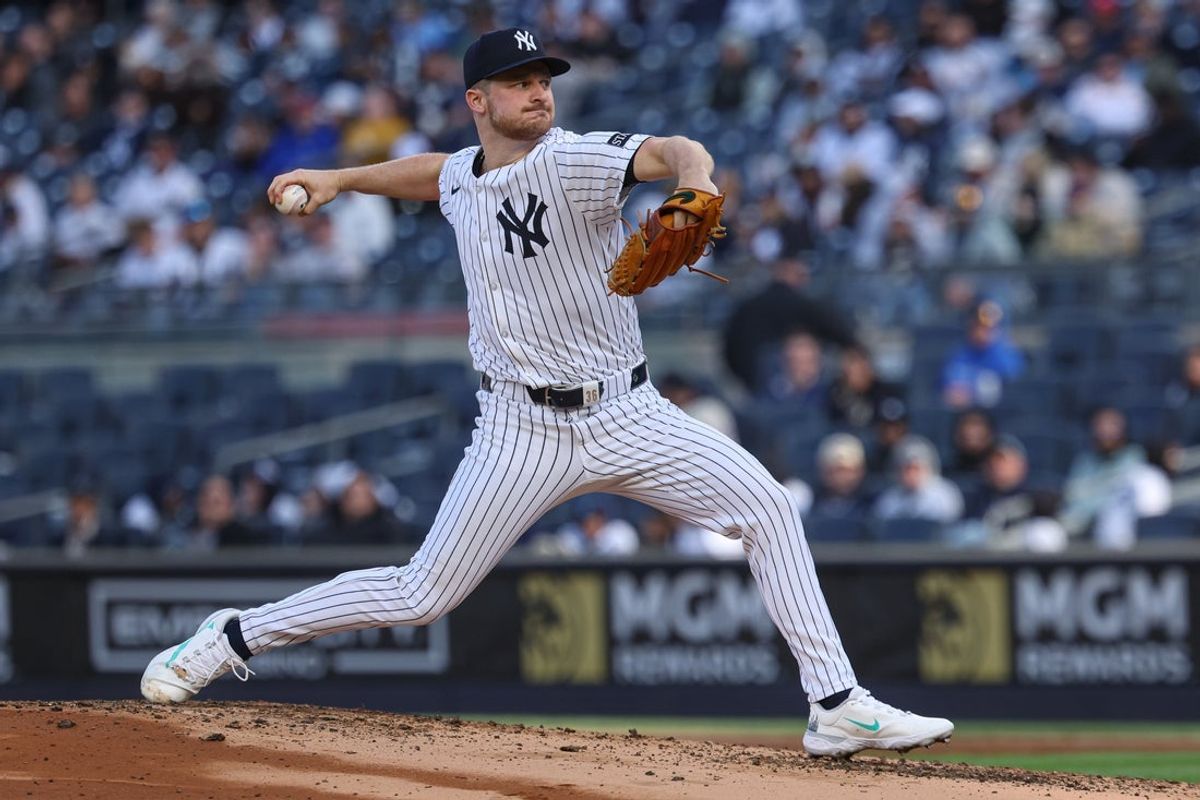 Apr 27, 2025; Bronx, New York, USA; New York Yankees starting pitcher Clarke Schmidt (36) delivers a pitch during the second inning against the Toronto Blue Jays at Yankee Stadium. Mandatory Credit: Vincent Carchietta-Imagn Images