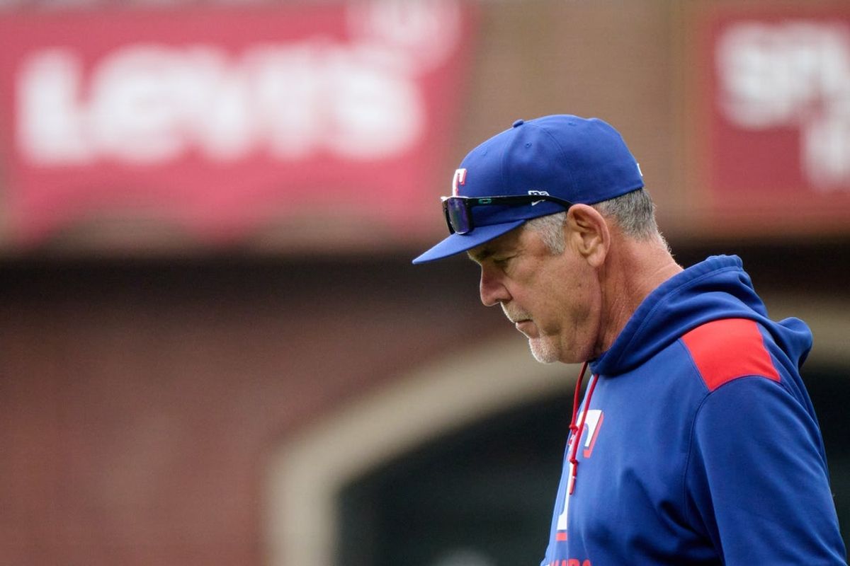Apr 27, 2025; San Francisco, California, USA; Texas Rangers manager Bruce Bochy (15) walks to the mound for a pitching change against the San Francisco Giants during the seventh inning at Oracle Park. Mandatory Credit: Robert Edwards-Imagn Images