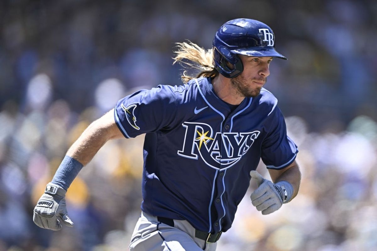 Apr 27, 2025; San Diego, California, USA; Tampa Bay Rays outfielder Travis Jankowski runs to first base during the third inning against the San Diego Padres at Petco Park. Mandatory Credit: Denis Poroy-Imagn Images
