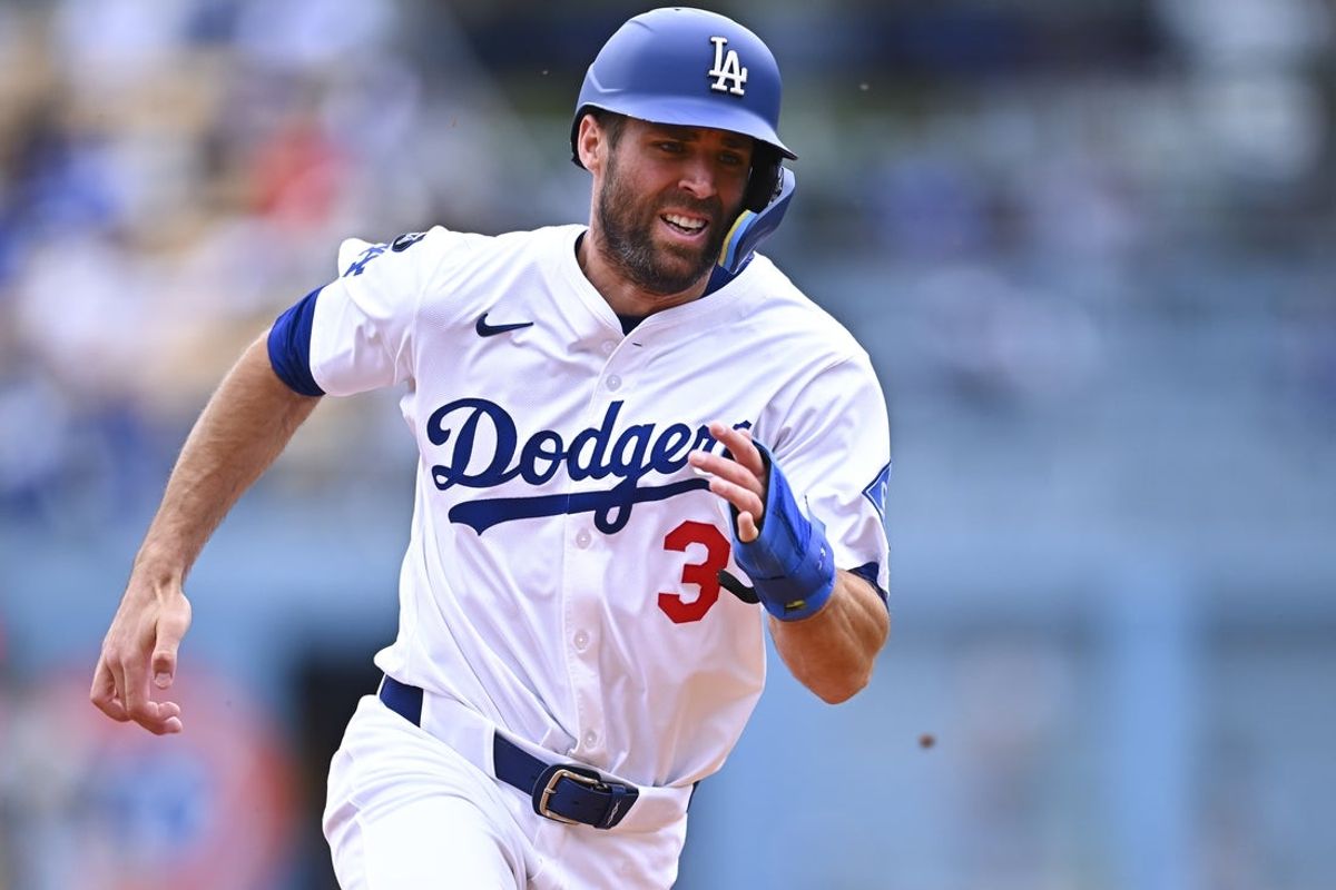 Apr 27, 2025; Los Angeles, California, USA; Los Angeles Dodgers outfielder Chris Taylor (3) scores from second base against the Pittsburgh Pirates during the sixth inning at Dodger Stadium. Mandatory Credit: Jonathan Hui-Imagn Images