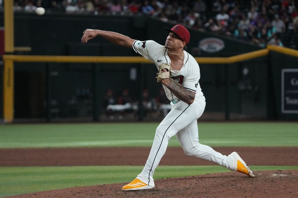 Apr 27, 2025; Phoenix, Arizona, USA; Arizona Diamondbacks pitcher Justin Martinez (63) throws against the Atlanta Braves in the ninth inning at Chase Field. Mandatory Credit: Rick Scuteri-Imagn Images