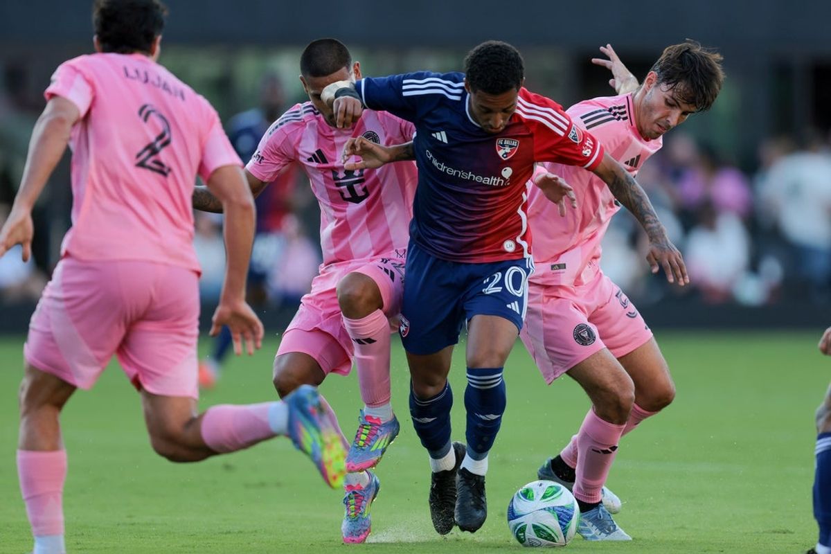 Apr 27, 2025; Fort Lauderdale, Florida, USA; FC Dallas midfielder Pedrinho (20) dribbles the ball past Inter Miami CF defender David Martinez (14) and midfielder Federico Redondo (55) during the second half at Chase Stadium. Mandatory Credit: Sam Navarro-Imagn Images