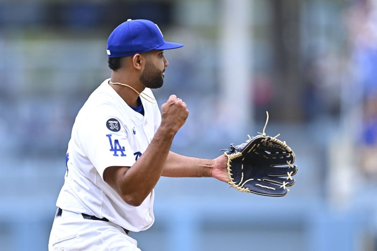 Apr 27, 2025; Los Angeles, California, USA; Los Angeles Dodgers pitcher Yoendrys Gomez (94) celebrates after throwing a strike to defeat the Pittsburgh Pirates during the ninth inning at Dodger Stadium. Mandatory Credit: Jonathan Hui-Imagn Images