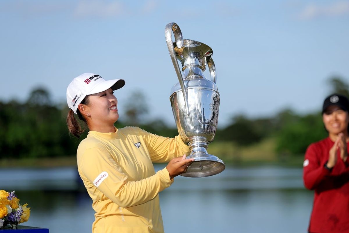 Apr 27, 2025; The Woodlands, Texas, USA; Mao Saigo of Japan raises the championship trophy after winning The Chevron Championship golf tournament. Mandatory Credit: Erik Williams-Imagn Images