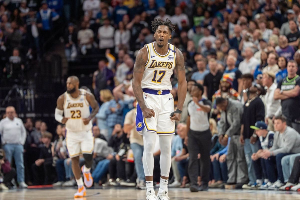 Apr 27, 2025; Minneapolis, Minnesota, USA; Los Angeles Lakers forward Dorian Finney-Smith (17) celebrates after scoring a three pointer agains the Minnesota Timberwolves in the fourth quarter during game four of first round for the 2025 NBA Playoffs at Target Center. Mandatory Credit: Matt Blewett-Imagn Images