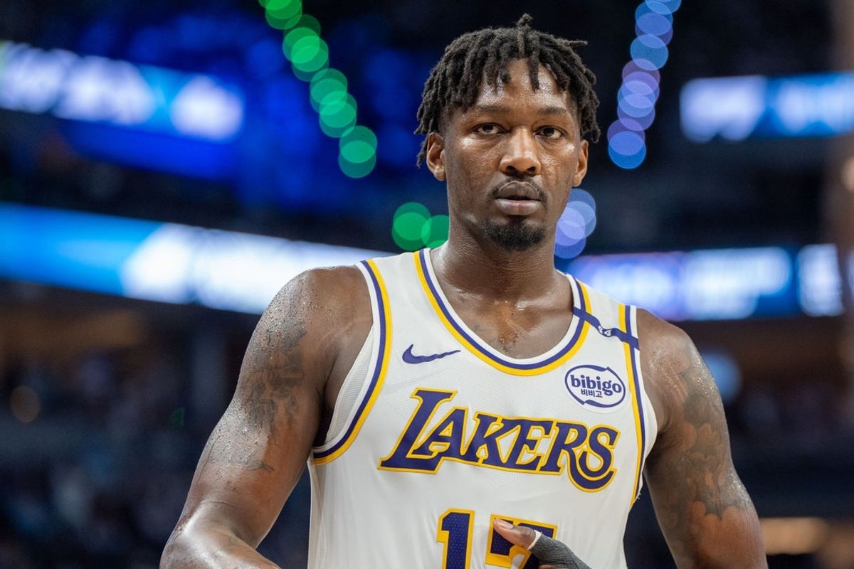 Apr 27, 2025; Minneapolis, Minnesota, USA; Los Angeles Lakers forward Dorian Finney-Smith (17) heads to the sidelines to inbound the ball against the Minnesota Timberwolves in the third quarter during game four of first round for the 2025 NBA Playoffs at Target Center. Mandatory Credit: Matt Blewett-Imagn Images