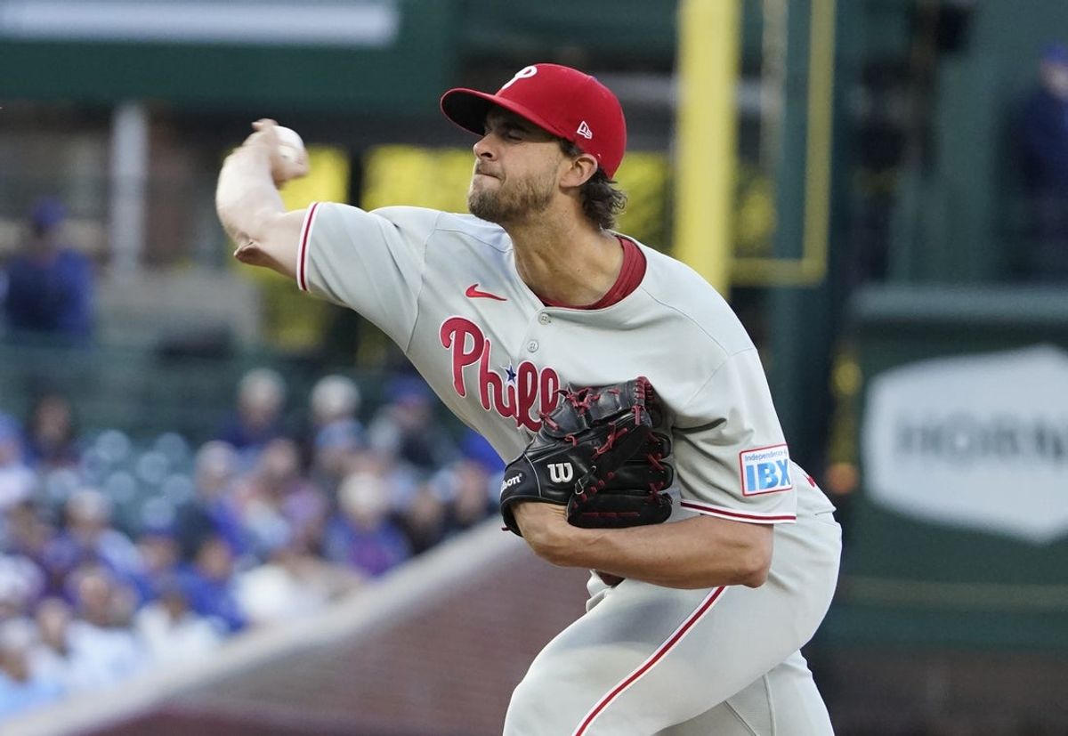 Apr 27, 2025; Chicago, Illinois, USA; Philadelphia Phillies pitcher Aaron Nola (27) throws the ball against the Chicago Cubs during the first inning at Wrigley Field. Mandatory Credit: David Banks-Imagn Images