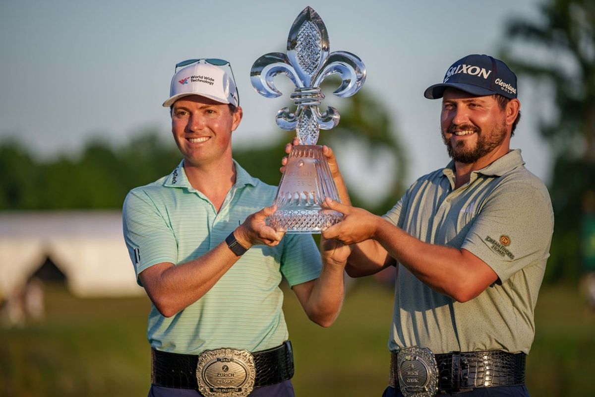 Apr 27, 2025; Avondale, Louisiana, USA; Ben Griffin, left, celebrates with teammate Andrew Novak after winning on the 18th hole during the final round of the Zurich Classic of New Orleans golf tournament. Mandatory Credit: Matthew Hinton-Imagn Images