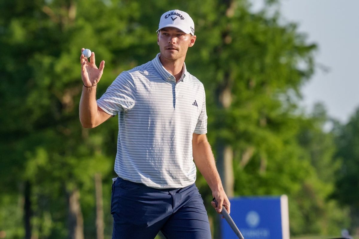 Apr 27, 2025; Avondale, Louisiana, USA; Nicolai Hojgaard celebrates a putt for birdie on the 18th green during the final round of the Zurich Classic of New Orleans golf tournament. Mandatory Credit: Matthew Hinton-Imagn Images