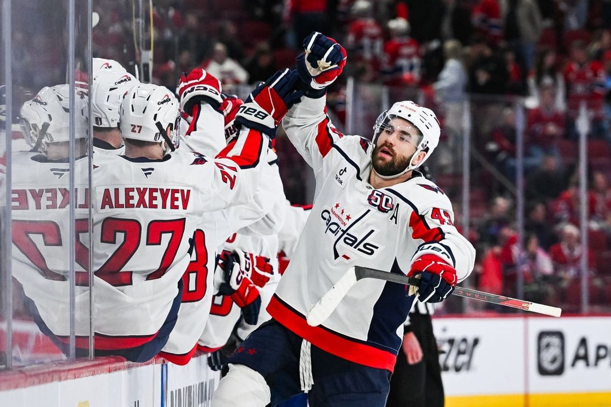 Apr 27, 2025; Montreal, Quebec, CAN; Washington Capitals right wing Tom Wilson (43) celebrates with his teammates at the bench his goal against the Montreal Canadiens during the third period in game four of the first round of the 2025 Stanley Cup Playoffs at Bell Centre. Mandatory Credit: David Kirouac-Imagn Images