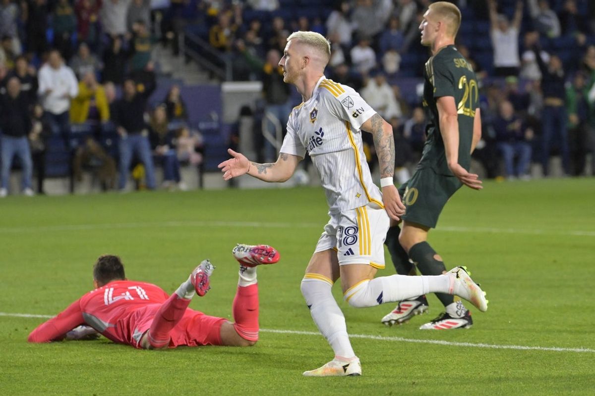 Apr 27, 2025; Carson, California, USA;  Los Angeles Galaxy forward Marco Reus (18) celebrates after scoring past Portland Timbers goalkeeper James Pantemis (41) in the second half at Dignity Health Sports Park. Mandatory Credit: Jayne Kamin-Oncea-Imagn Images