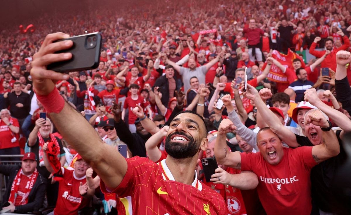 [US, Mexico & Canada customers only] April 27, 2025; Anfield, Liverpool, BRITAIN; Liverpool player Mohamed Salah celebrates by taking a selfie after winning the Premier League. Mandatory Credit: Phil Noble/Reuters via Imagn Images