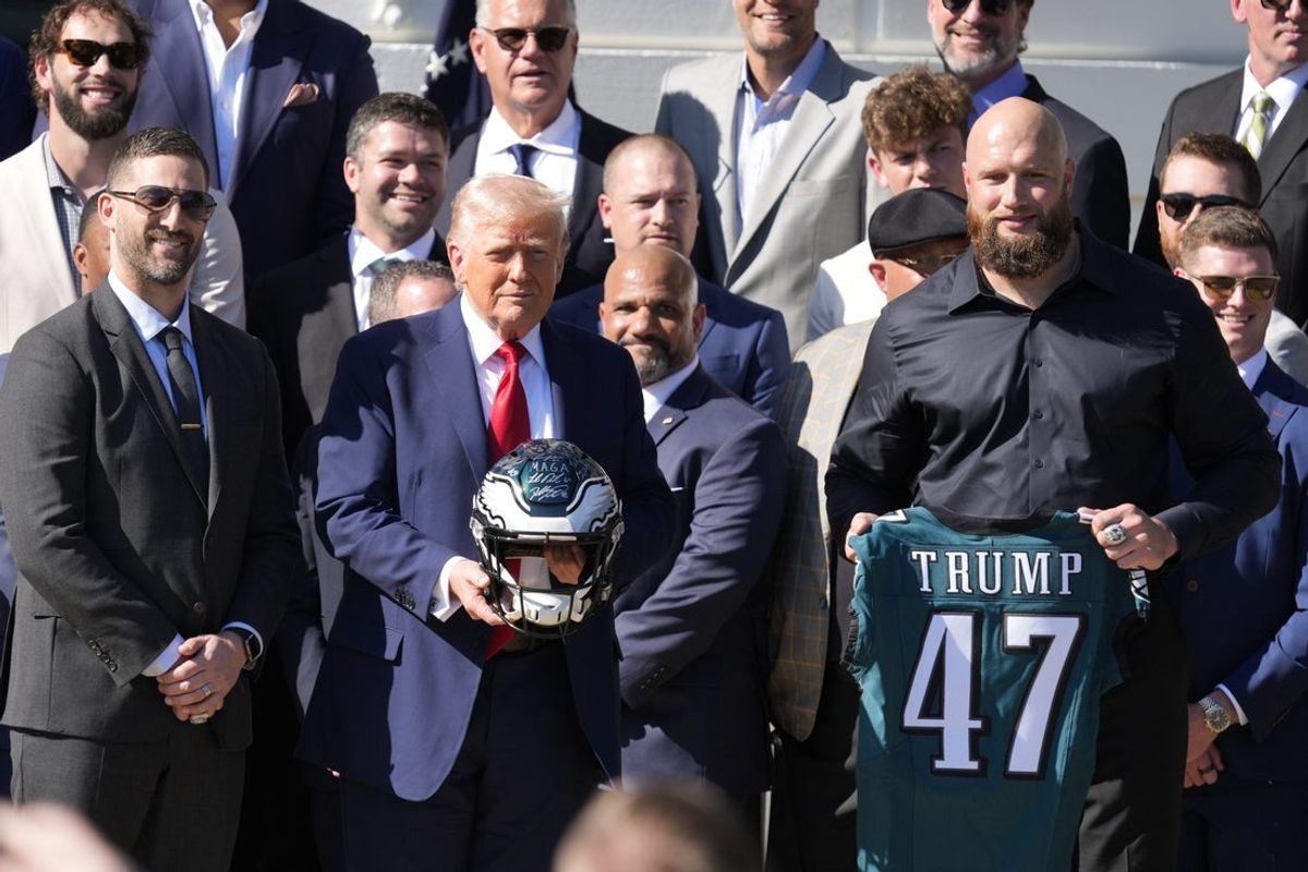 Philadelphia EaglesÕ head coach Nick Sirianni, left, and offensive tackle Lane Johnson stand next to President Donald Trump as he honors the Super Bowl LIX champion Philadelphia Eagles at The White House in Washington D.C., on April 28, 2025.