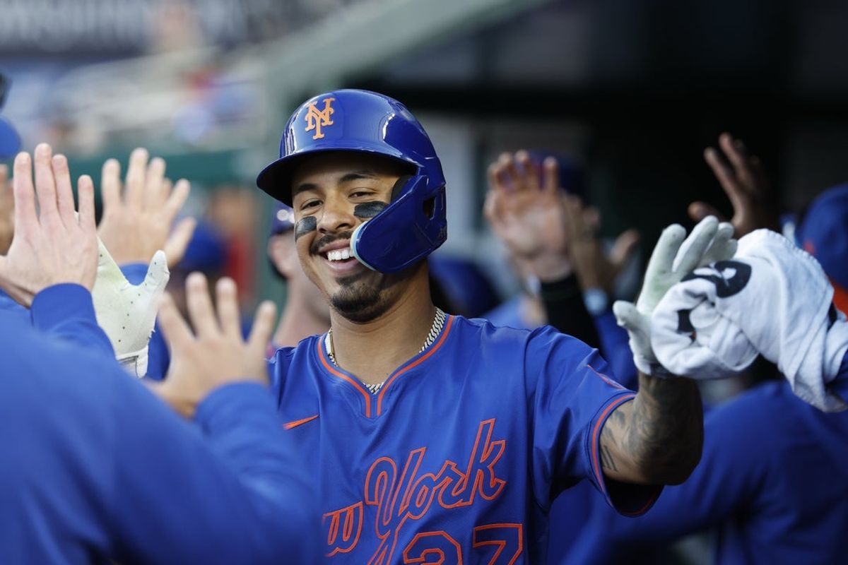 Apr 28, 2025; Washington, District of Columbia, USA; New York Mets third base Mark Vientos (27) celebrates with teammates in the dugout after hitting a three run home run against the Washington Nationals during the ninth inning at Nationals Park. Mandatory Credit: Geoff Burke-Imagn Images