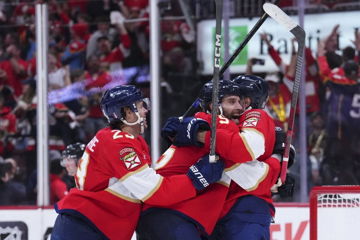 Apr 28, 2025; Sunrise, Florida, USA; Florida Panthers defenseman Aaron Ekblad (5) celebrates with teammates after scoring against the Tampa Bay Lightning during the third period in game four of the first round of the 2025 Stanley Cup Playoffs at Amerant Bank Arena. Mandatory Credit: Rich Storry-Imagn Images
