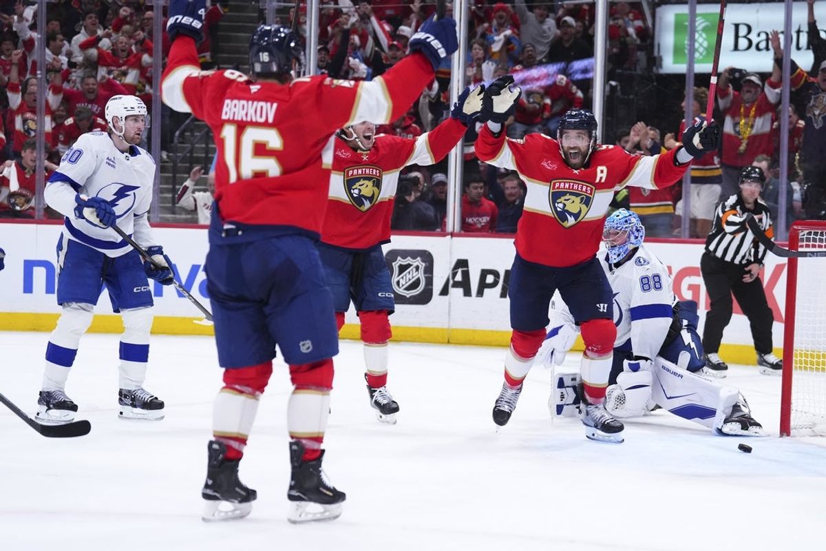 Apr 28, 2025; Sunrise, Florida, USA; Florida Panthers defenseman Aaron Ekblad (5) celebrates with teammates after scoring against the Tampa Bay Lightning during the third period in game four of the first round of the 2025 Stanley Cup Playoffs at Amerant Bank Arena. Mandatory Credit: Rich Storry-Imagn Images