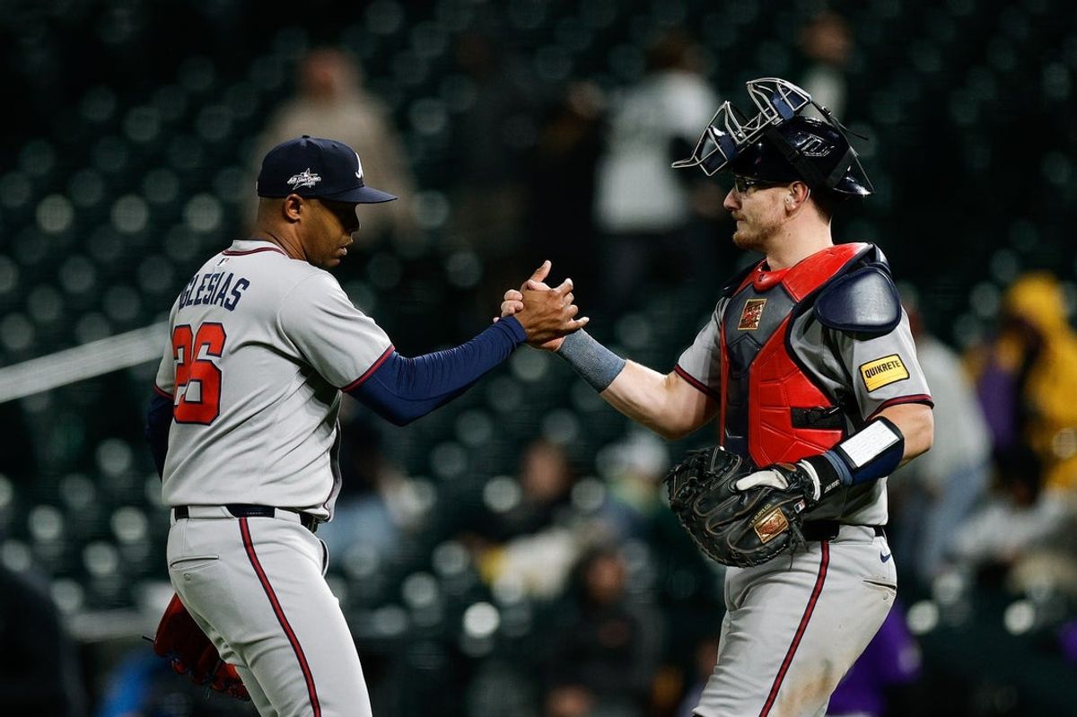 Apr 28, 2025; Denver, Colorado, USA; Atlanta Braves relief pitcher Raisel Iglesias (26) celebrates with catcher Sean Murphy (12) after the game against the Colorado Rockies at Coors Field. Mandatory Credit: Isaiah J. Downing-Imagn Images