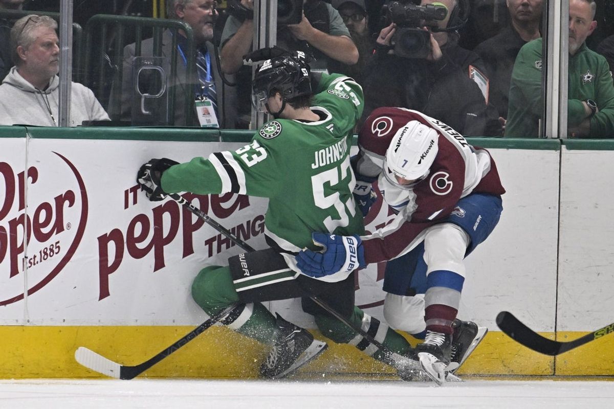 Apr 28, 2025; Dallas, Texas, USA; Dallas Stars center Wyatt Johnston (53) and Colorado Avalanche defenseman Devon Toews (7) crash into the boards during the third period in game five of the first round of the 2025 Stanley Cup Playoffs at American Airlines Center. Mandatory Credit: Jerome Miron-Imagn Images
