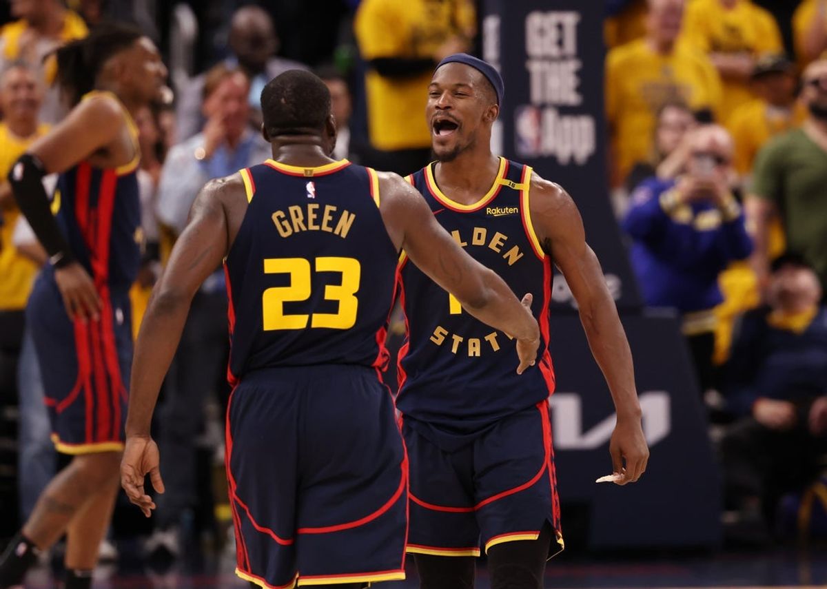 Apr 28, 2025; San Francisco, California, USA; Golden State Warriors forward Draymond Green (23) celebrates with forward Jimmy Butler III (10) after a play against the Houston Rockets during the fourth quarter of game four of the 2025 NBA Playoffs first round at Chase Center. Mandatory Credit: Kelley L Cox-Imagn Images