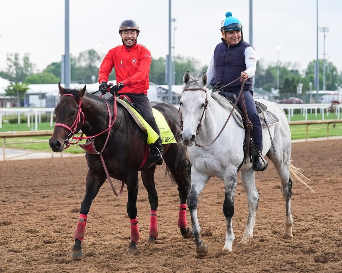 Kentucky Derby hopeful Admire Daytona walks on the track as assistant trainer Yoshimutsu Miyashita has a laugh Tuesday April 29, 2025 at Churchill Downs in Louisville, Kentucky.