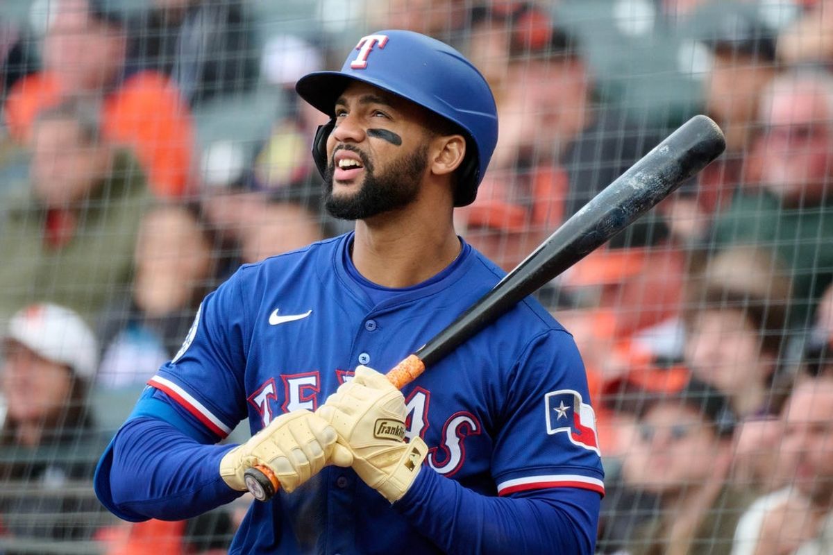 Apr 27, 2025; San Francisco, California, USA; Texas Rangers outfielder Leody Taveras (3) looks on in the on-deck circle against the San Francisco Giants during the seventh inning at Oracle Park. Mandatory Credit: Robert Edwards-Imagn Images