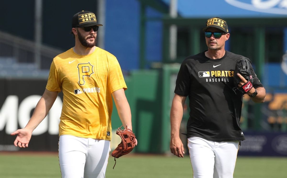 Apr 29, 2025; Pittsburgh, Pennsylvania, USA; Pittsburgh Pirates pitcher Paul Skenes (left) and bench coach Don Kelly (right) talk in the outfield before the game against the Chicago Cubs at PNC Park. Mandatory Credit: Charles LeClaire-Imagn Images