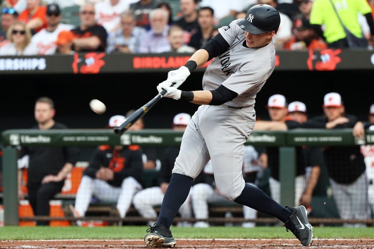 Apr 29, 2025; Baltimore, Maryland, USA; New York Yankees first baseman Ben Rice (22) hits a home run during the second inning against the Baltimore Orioles at Oriole Park at Camden Yards. Mandatory Credit: Daniel Kucin Jr.-Imagn Images