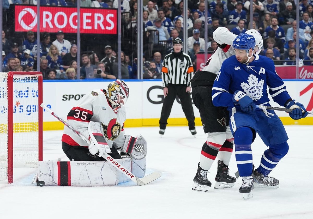 Apr 29, 2025; Toronto, Ontario, CAN; Toronto Maple Leafs center John Tavares (91) looks for a rebound in front of Ottawa Senators goaltender Linus Ullmark (35) in the first period during game five of the first round of the 2025 Stanley Cup Playoffs at Scotiabank Arena. Mandatory Credit: Nick Turchiaro-Imagn Images