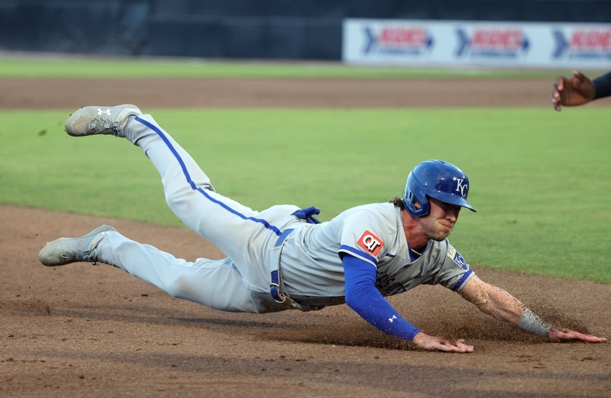 Apr 29, 2025; St. Petersburg, Florida, USA;  Kansas City Royals outfielder Drew Waters (8) slides into third against the Tampa Bay Rays during the second inning at George M. Steinbrenner Field. Mandatory Credit: Kim Klement Neitzel-Imagn Images