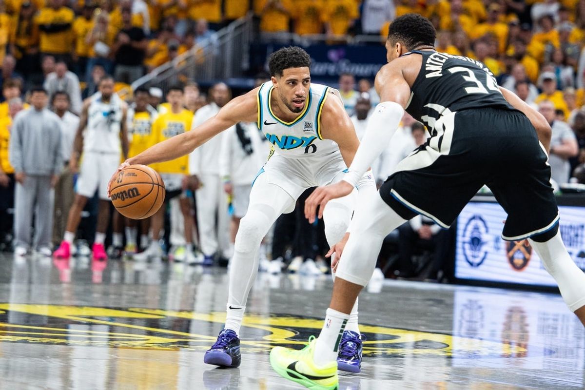 Apr 29, 2025; Indianapolis, Indiana, USA; Indiana Pacers guard Tyrese Haliburton (0) dribbles the ball while Milwaukee Bucks forward Giannis Antetokounmpo (34) defends during game five of the first round for the 2024 NBA Playoffs at Gainbridge Fieldhouse. Mandatory Credit: Trevor Ruszkowski-Imagn Images