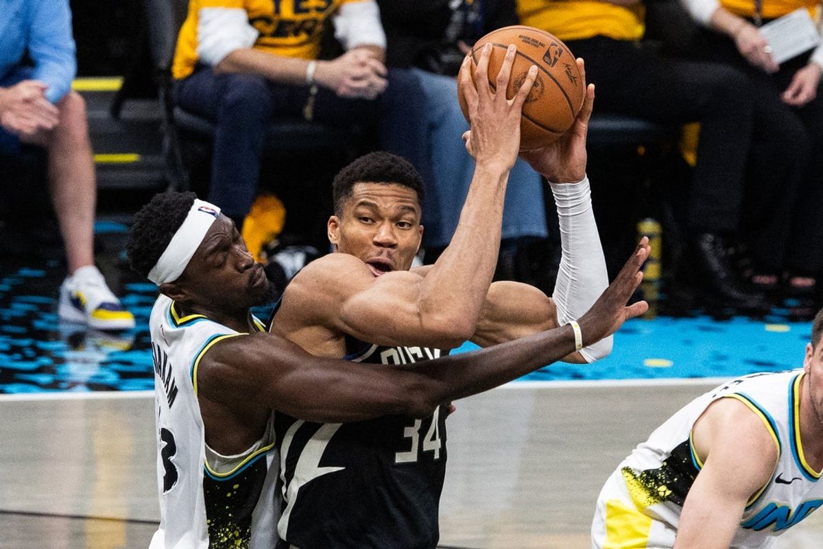 Apr 29, 2025; Indianapolis, Indiana, USA; Milwaukee Bucks forward Giannis Antetokounmpo (34) shoots the ball while Indiana Pacers forward Pascal Siakam (43)  defends during game five of the first round for the 2024 NBA Playoffs at Gainbridge Fieldhouse. Mandatory Credit: Trevor Ruszkowski-Imagn Images