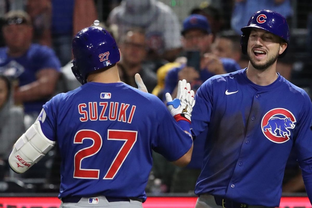 Apr 29, 2025; Pittsburgh, Pennsylvania, USA;  Chicago Cubs right fielder Kyle Tucker (right) congratulates designated hitter Seiya Suzuki (27) after his two-run home run against the Pittsburgh Pirates during the seventh inning at PNC Park. Mandatory Credit: Charles LeClaire-Imagn Images