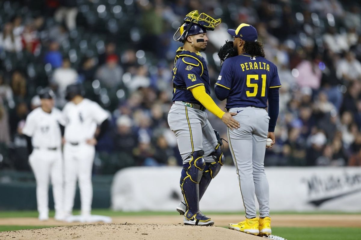 Apr 29, 2025; Chicago, Illinois, USA; Milwaukee Brewers catcher William Contreras (24) talks with starting pitcher Freddy Peralta (51) during the fifth inning against the Chicago White Sox at Rate Field. Mandatory Credit: Kamil Krzaczynski-Imagn Images
