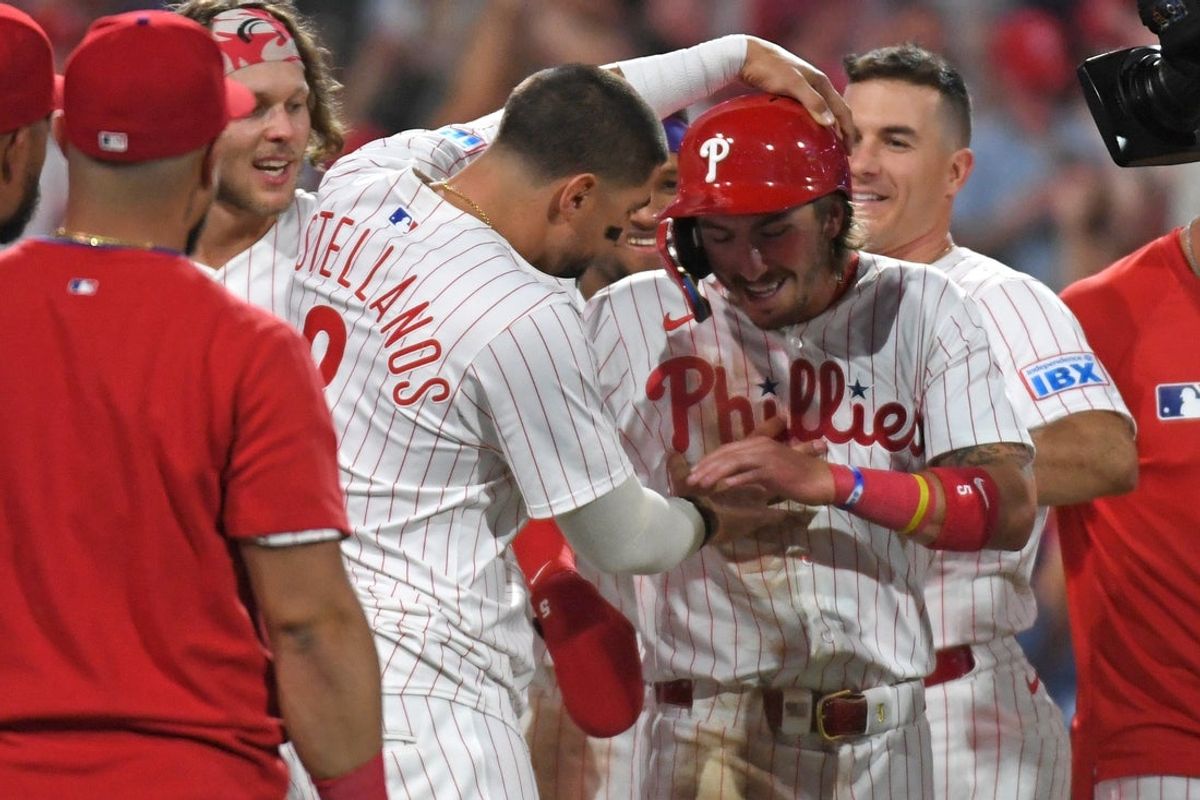 Apr 29, 2025; Philadelphia, Pennsylvania, USA; Philadelphia Phillies second base Bryson Stott (5) celebrates with outfielder Nick Castellanos (8) after scoring the winning run on a wild pitch during the ninth inning against the Washington Nationals at Citizens Bank Park. Mandatory Credit: Eric Hartline-Imagn Images