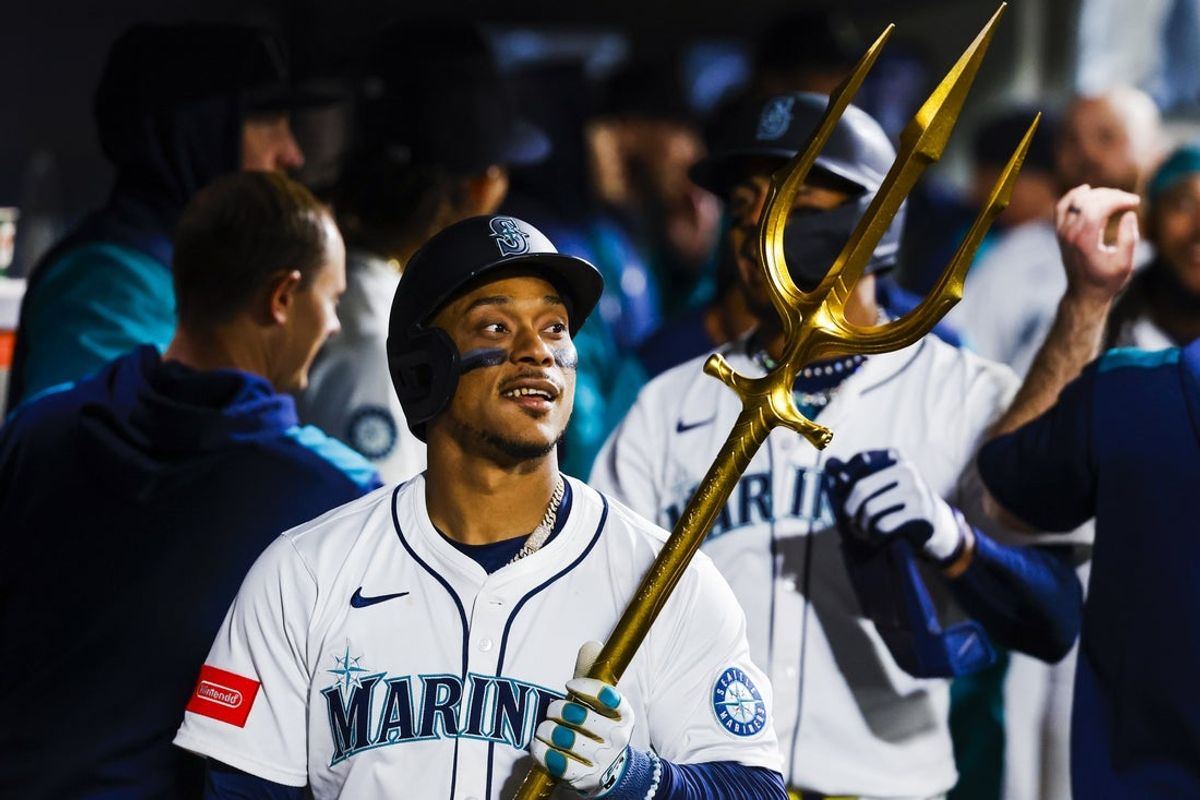 Apr 29, 2025; Seattle, Washington, USA; Seattle Mariners designated hitter Jorge Polanco (7) celebrates in the dugout after hitting a two-run home run against the Los Angeles Angels during the seventh inning at T-Mobile Park. Mandatory Credit: Joe Nicholson-Imagn Images
