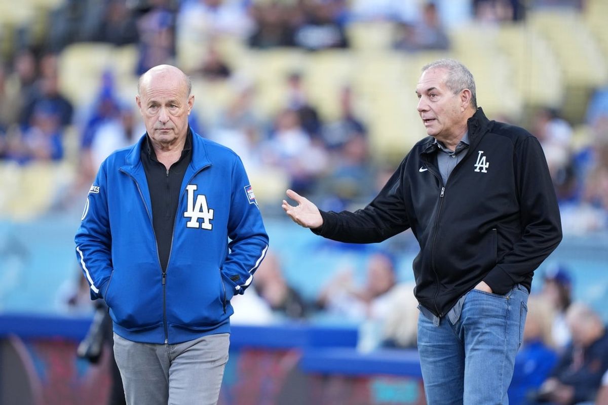 Apr 29, 2025; Los Angeles, California, USA; Los Angeles Dodgers president Stan Kasten (left) and executive vice president Lon Rosen before a game against the Miami Marlins at Dodger Stadium. Mandatory Credit: Kirby Lee-Imagn Images