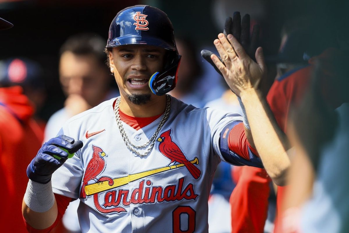 Apr 30, 2025; Cincinnati, Ohio, USA; St. Louis Cardinals shortstop Masyn Winn (0) high fives teammates after hitting a solo home run in the first inning against the Cincinnati Reds at Great American Ball Park. Mandatory Credit: Katie Stratman-Imagn Images