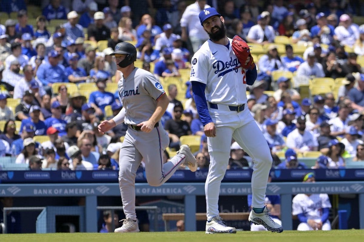 Apr 30, 2025; Los Angeles, California, USA; Los Angeles Dodgers starting pitcher Tony Gonsolin (26) reacts after giving up a home run to Miami Marlins right fielder Kyle Stowers (28) d48 at Dodger Stadium. Mandatory Credit: Jayne Kamin-Oncea-Imagn Images