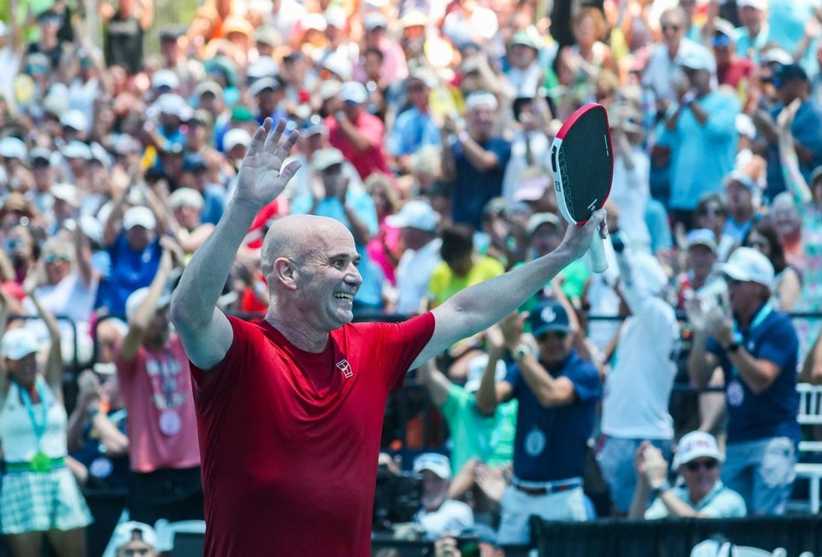 Andre Agassi smiles while celebrating during game three of a Minto U.S. Open Pickleball Championships mixed pro doubles match against Tristan Dussault and Stevie Petrpouleas at East Naples Community Park in Naples, Fla., on Wednesday, April 30, 2025.