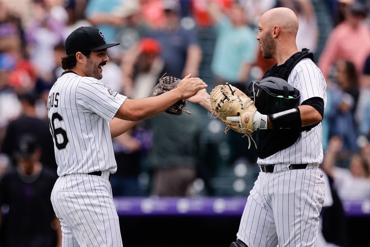 Apr 30, 2025; Denver, Colorado, USA; Colorado Rockies relief pitcher Zach Agnos (36) celebrates with catcher Jacob Stallings (25) after the game against the Atlanta Braves at Coors Field. Mandatory Credit: Isaiah J. Downing-Imagn Images